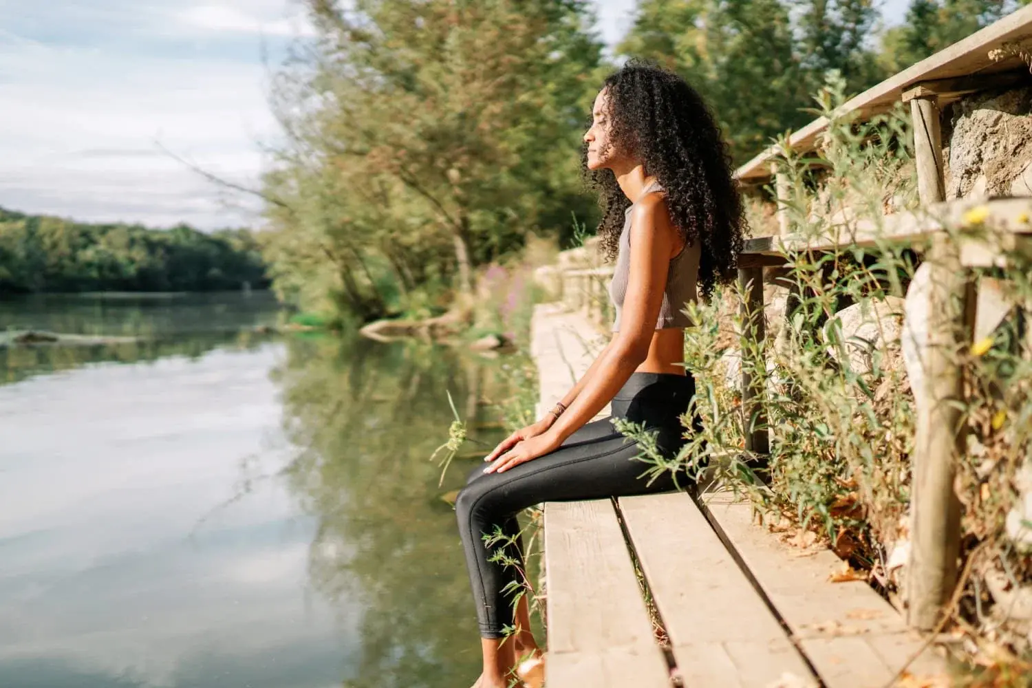 Person practising mindful breathing in a calm environment